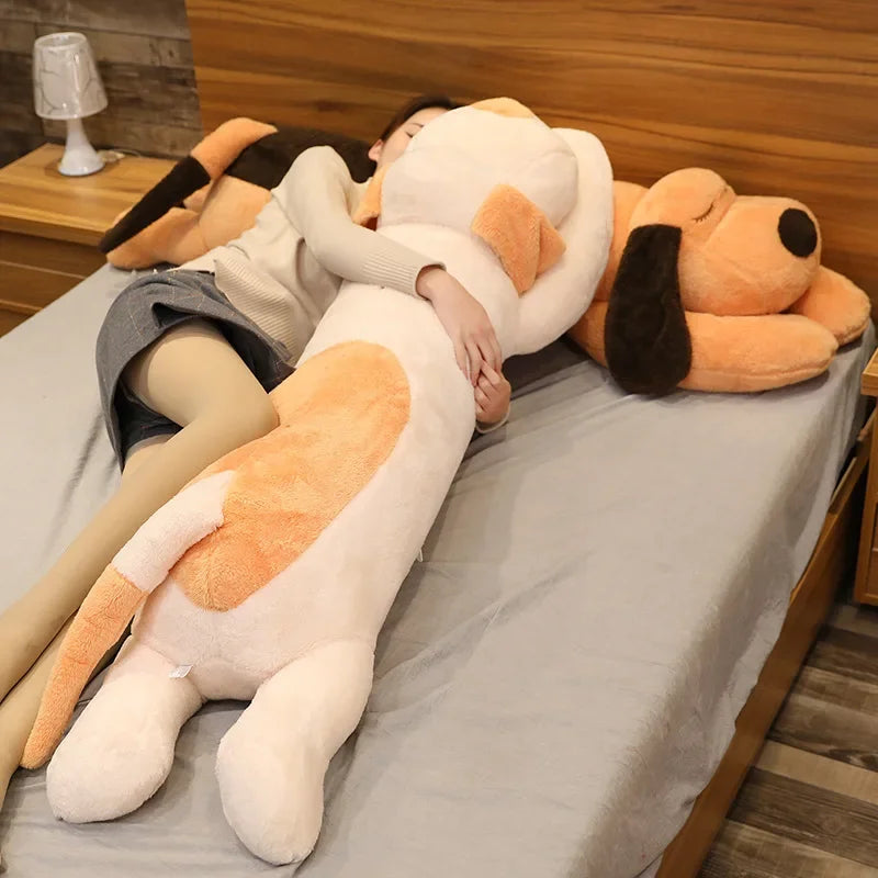 woman lying down in bed with two kawaii plush toys