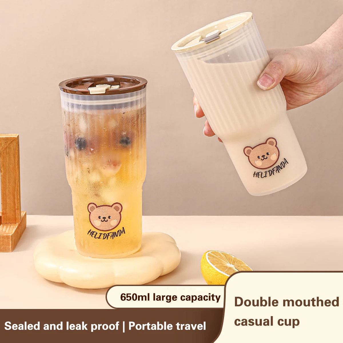 Two kawaii tumblers with bear designs on a beige background, one being held.