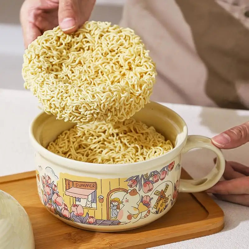 A hand placing instant noodles inside a kawaii ramen bowl