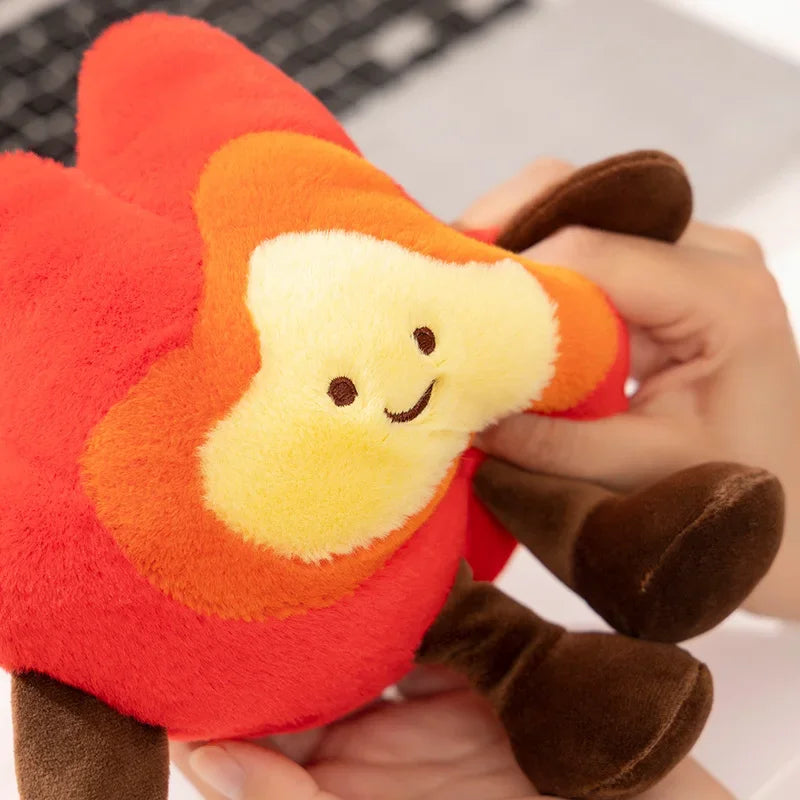 Kawaii plush toy shaped like a red apple with a smiling face held by a hand.