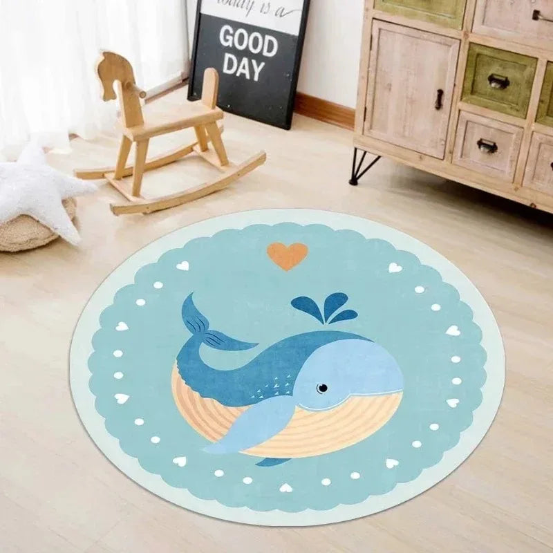 Round kawaii rug with a whale design on a wooden floor.
