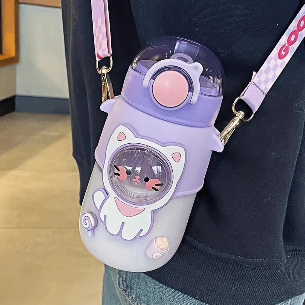 Purple cat-shaped kawaii water bottle with a pink lid and strap worn by a person.