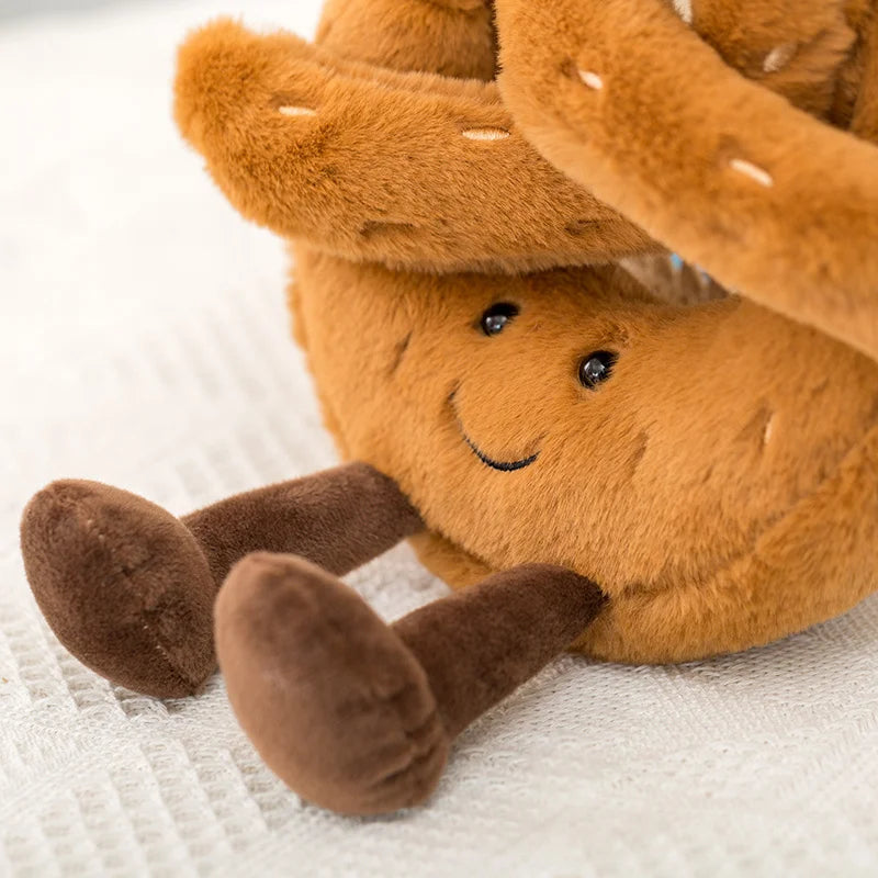Plush kawaii toy resembling a pine cone with a smiling face on a textured white background