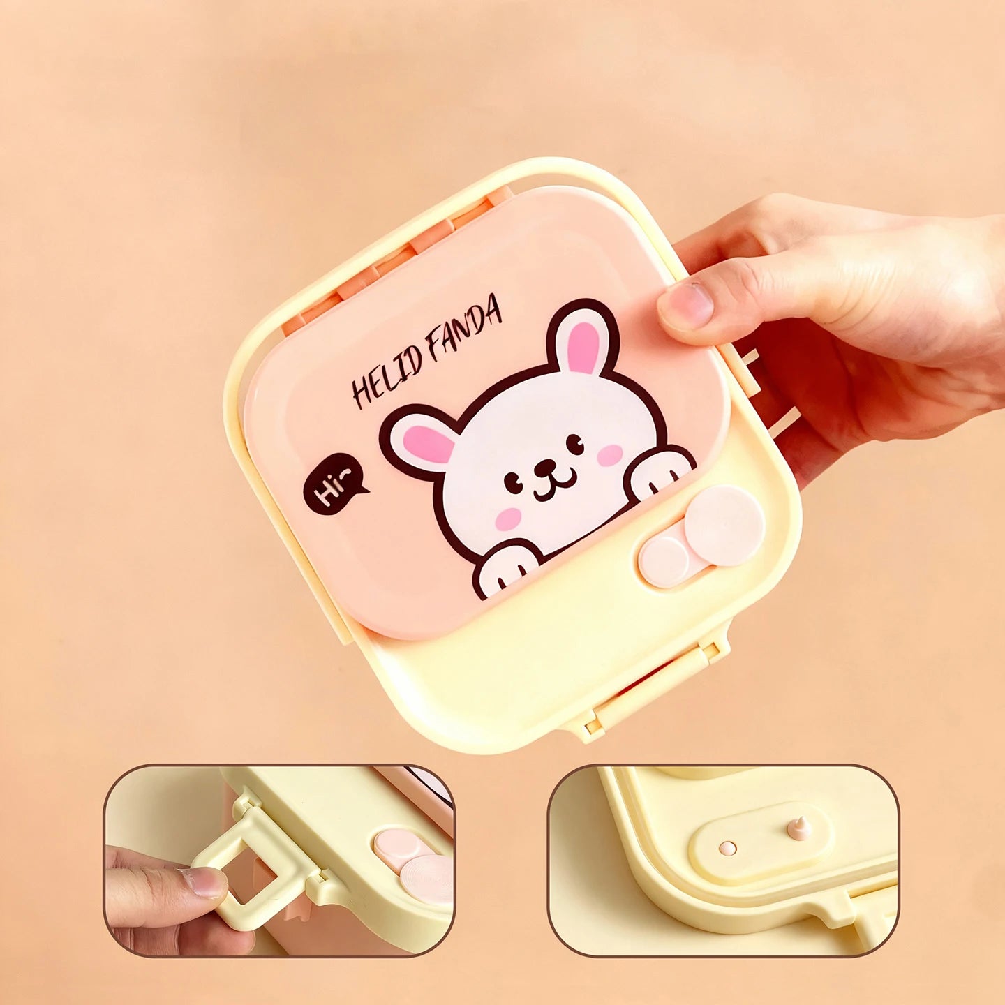Hand holding a small, pink and yellow kawaii food container with a cartoon character on a beige background