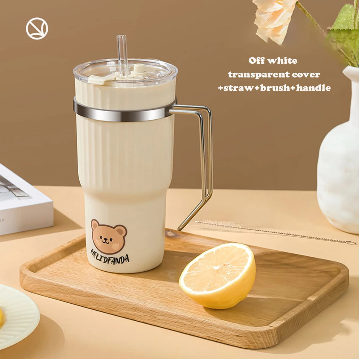 White kawaii mug with bear design on a wooden tray with lemon and books, against a beige background.