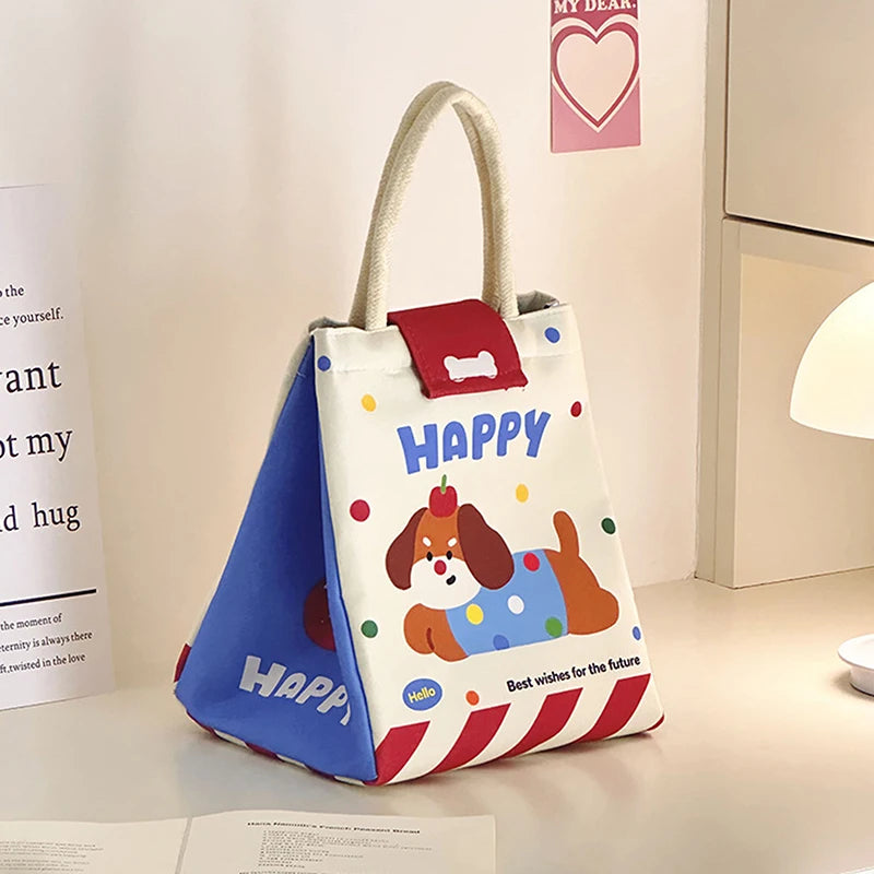 Children's kawaii tote bag with cartoon dog design and 'Happy' text on a light surface.