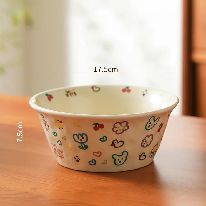 Decorative ceramic kawaii ramen bowl with colorful patterns on a wooden surface, showing measurements.