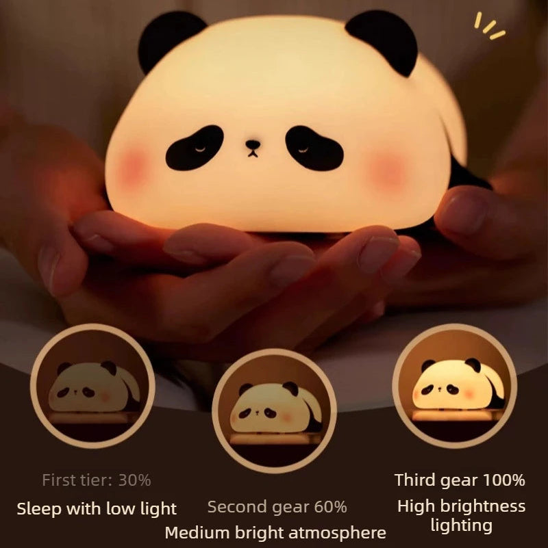 Panda-shaped kawaii night light held in hands with brightness control indicators.