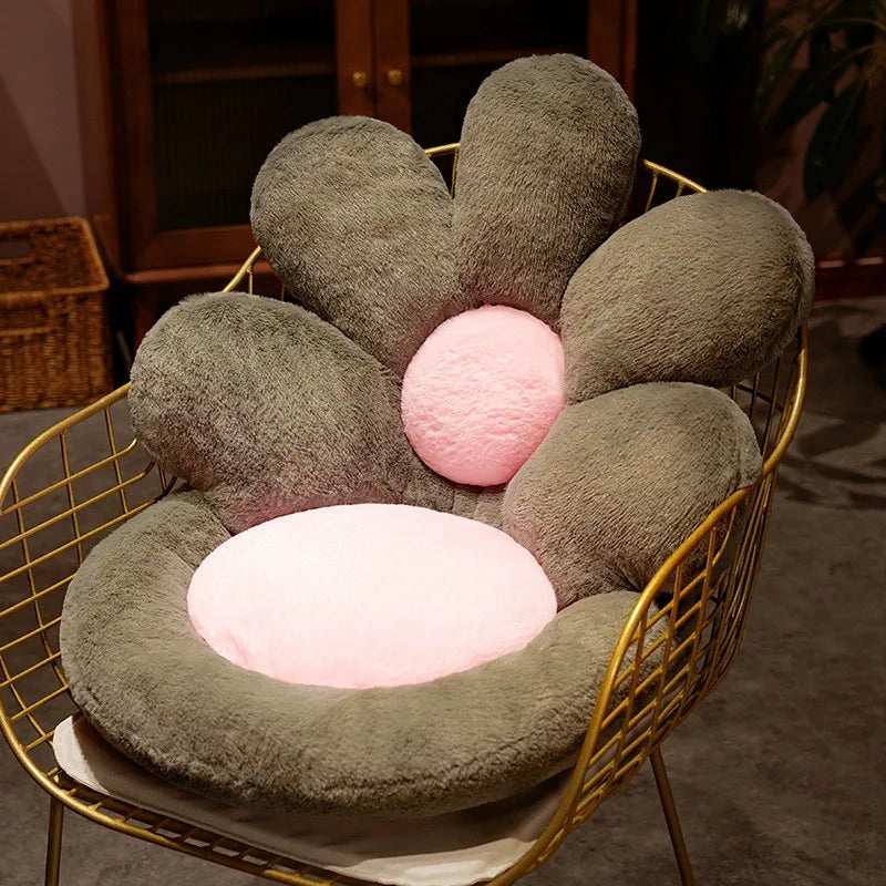 Flower-shaped kawaii cushion with pink center on a gold chair
