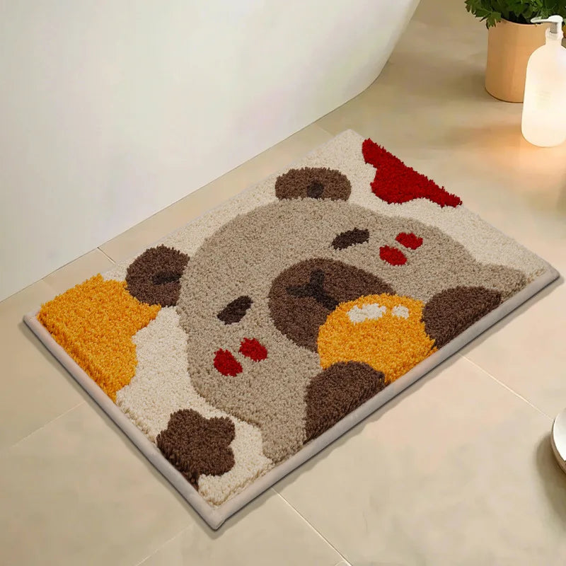 Decorative bath mat with cartoon character kawaii design on a bathroom floor.