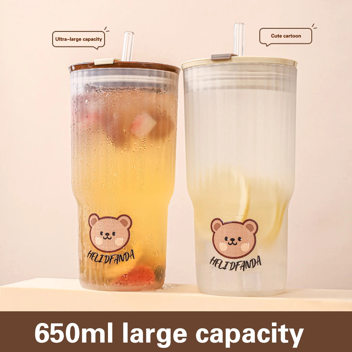 Two kawaii tumblers with bear design and 'HELIDFANDA' branding on a beige background.