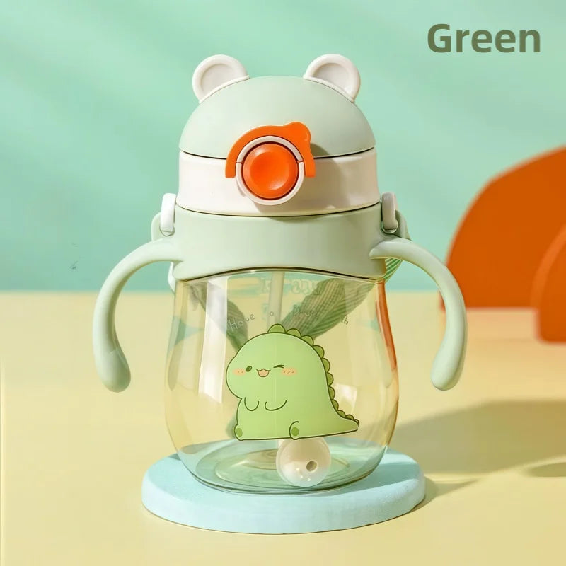 Green dinosaur-themed kawaii water bottle with handle and straw on a yellow background