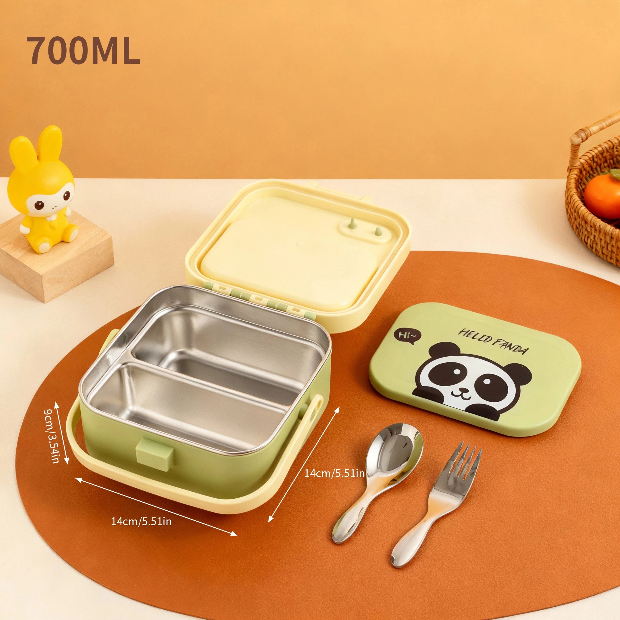 Green stainless steel kawaii lunch box with panda design, spoon, and fork on an orange surface.