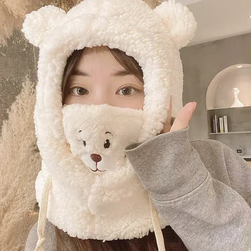 Person wearing a white Kawaii bear-shaped hooded mask indoors