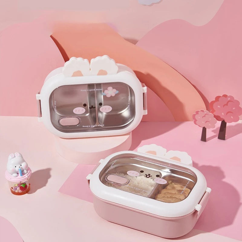 Two cute animal-themed kawaii lunch boxes on a pink background