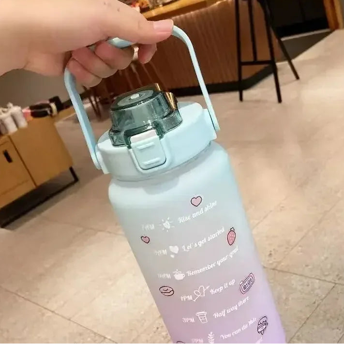 Light purple kawaii water bottle with text and heart designs held by a hand indoors.