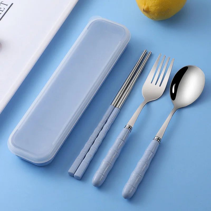 Set of silver kawaii utensils with blue handles on a blue background