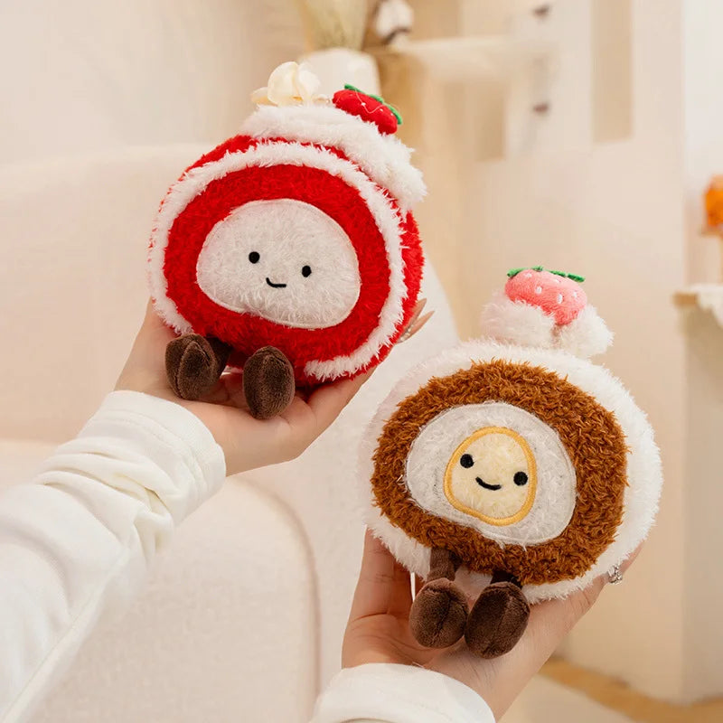 Two small kawaii plush toys resembling characters with red and brown bodies, white faces, and black eyes held in hands against a neutral background.