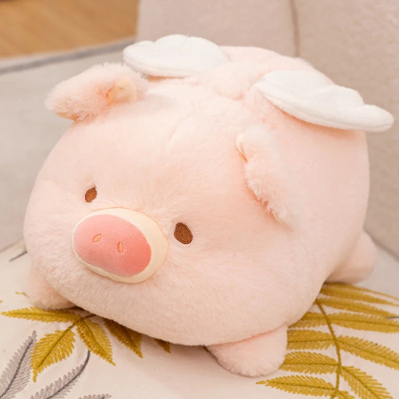 Kawaii plush pig toy on a decorative pillow with leaves