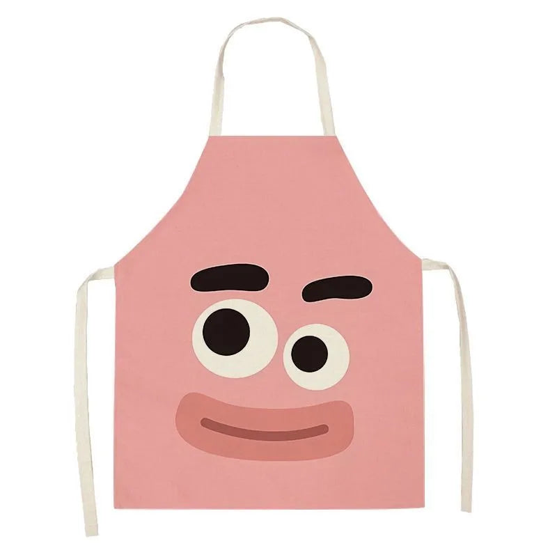 Pink kawaii apron with cartoon face design on a white background