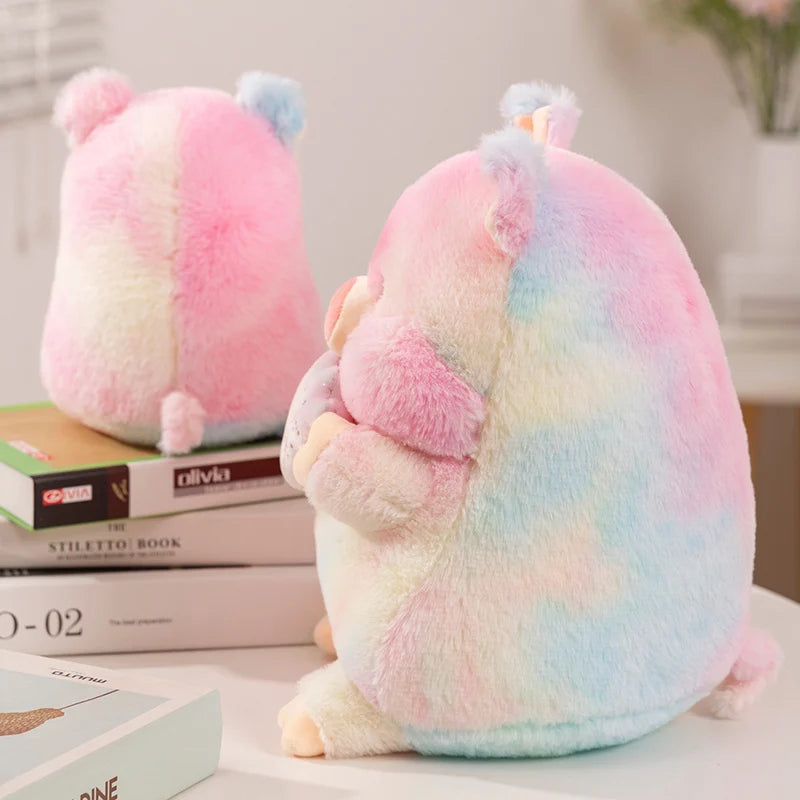 Side view of a rainbow colored kawaii pig plush toy