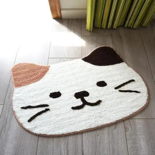 Cat-shaped kawaii doormat with a smiling face on a wooden floor