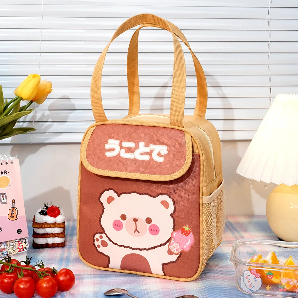 Kawaii-style bear-themed kawaii lunch bag on a table with snacks and a lamp in the background