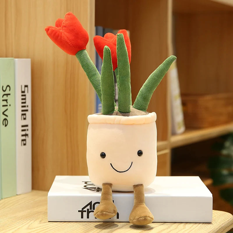 Plush kawaii toy cactus with red flowers on a book