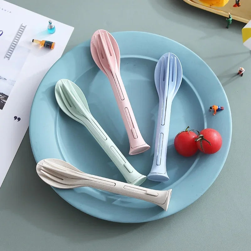 Four multicolored kawaii utensils on a plate