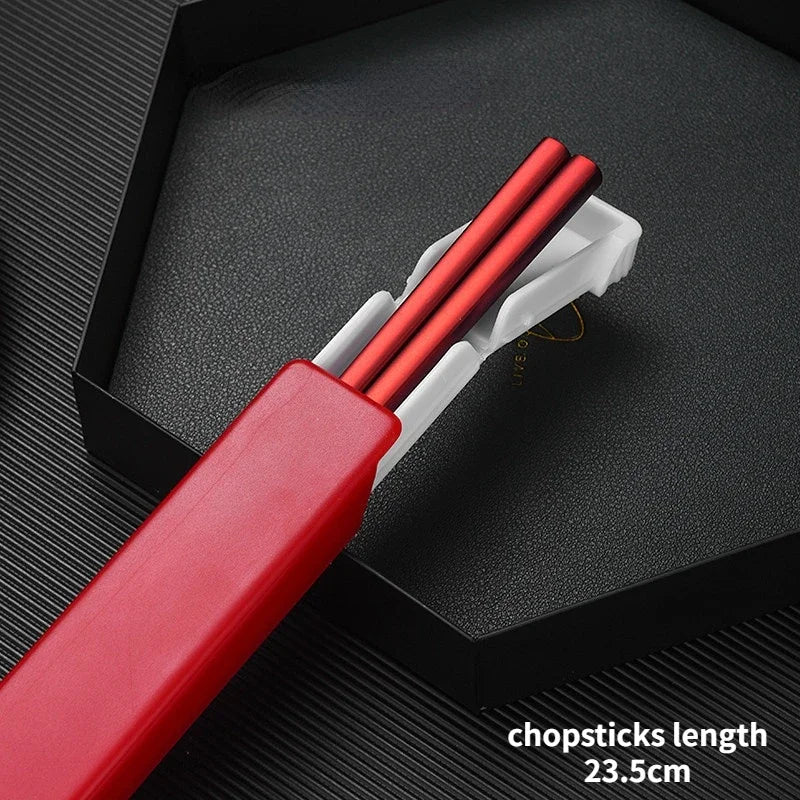 Red kawaii chopsticks in a black case on a dark textured surface