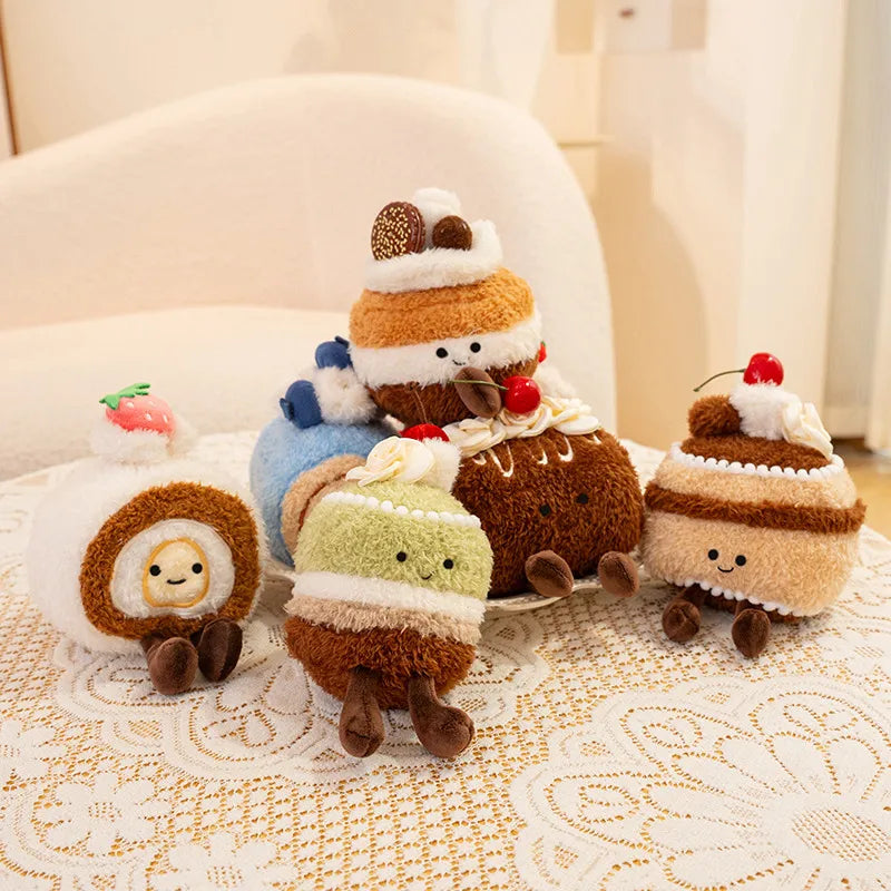Set of kawaii plush toys resembling ice cream cones and cakes on a textured surface.