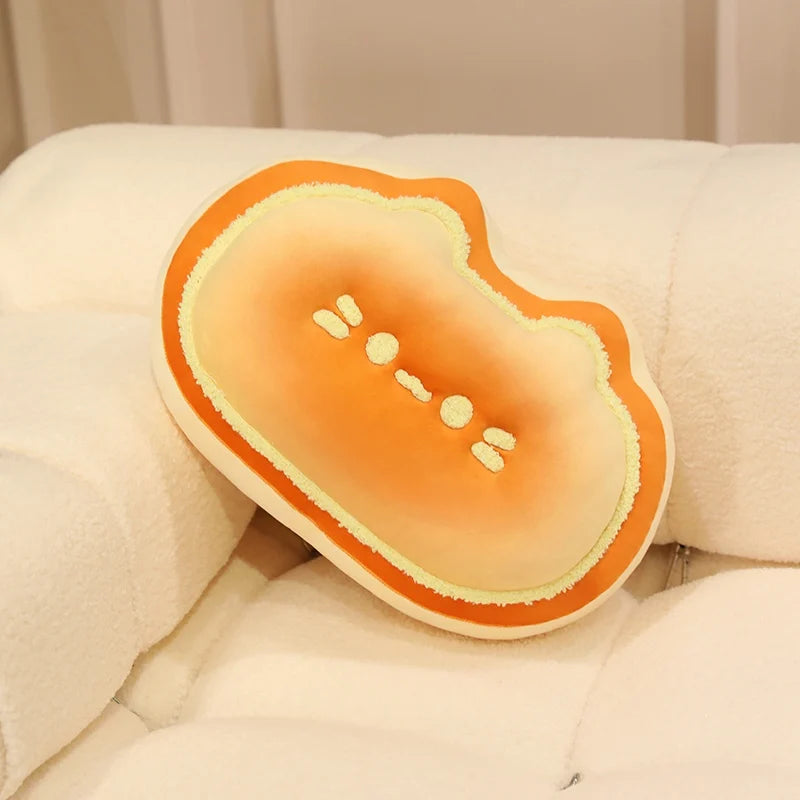 Kawaii plush toy shaped like a watermelon on a beige cushion