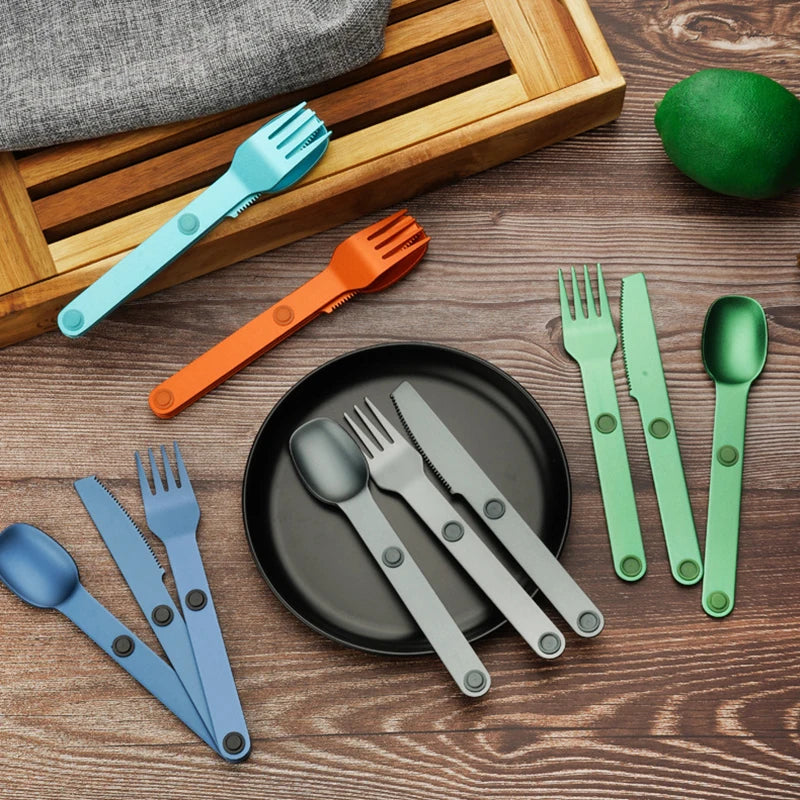 Colorful kawaii utensils set on a wooden surface with a plate and lime.