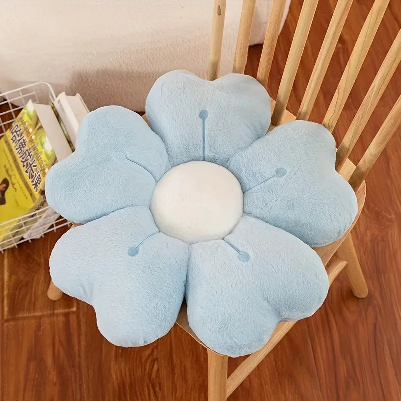 Flower-shaped kawaii cushion on a wooden chair with a blurred background