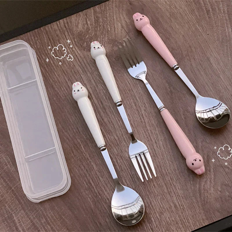 Two sets of white and pink kawaii utensils on the table