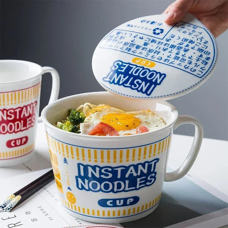 A hand removing a lid from an instant noodles kawaii ramen bowl