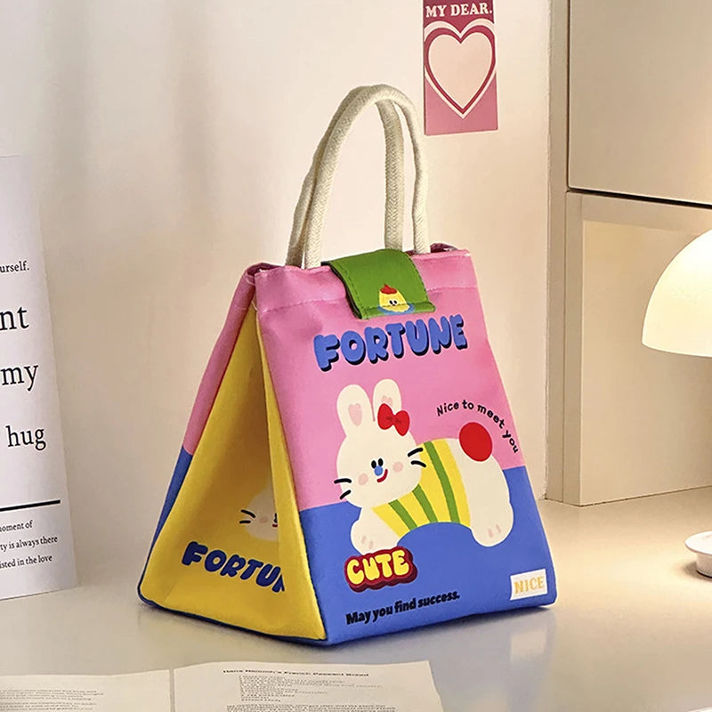 Colorful kawaii bag with cartoon character design on a surface