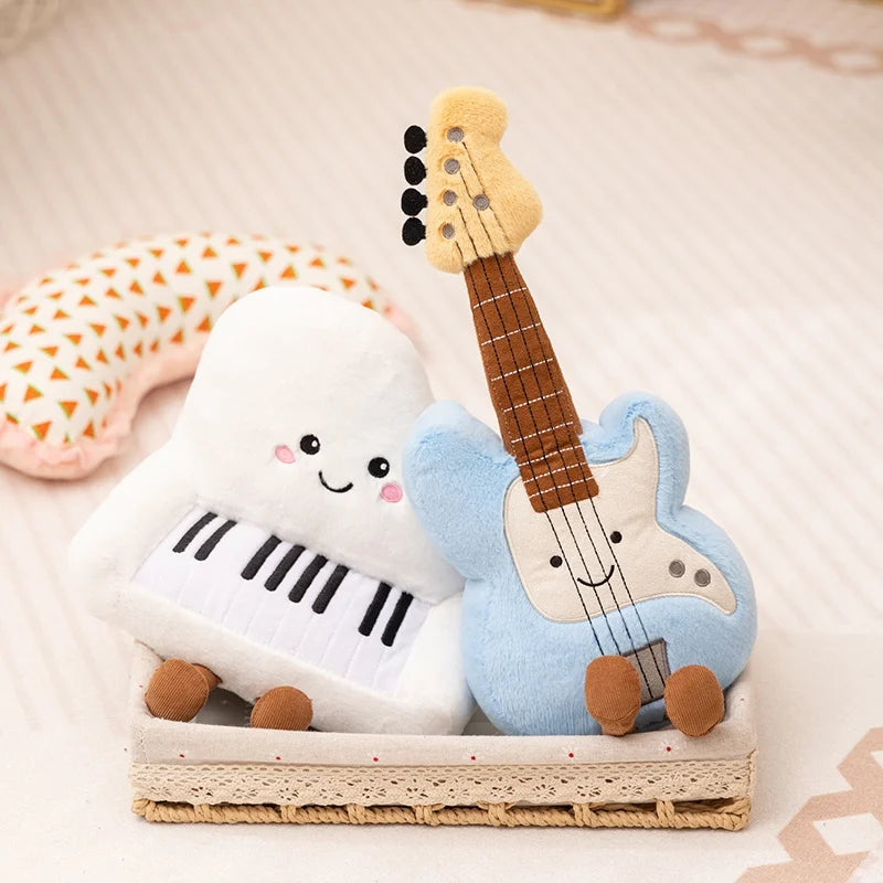 Kawaii plush toys shaped like a piano and a guitar on a wooden tray with a soft background