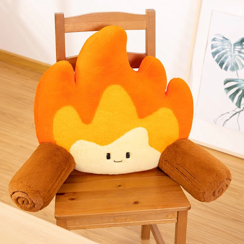 Flame-shaped kawaii cushion with a face on a wooden chair