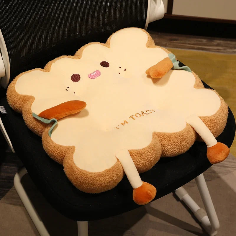Kawaii plush cloud-shaped cushion with a toast design on a chair.