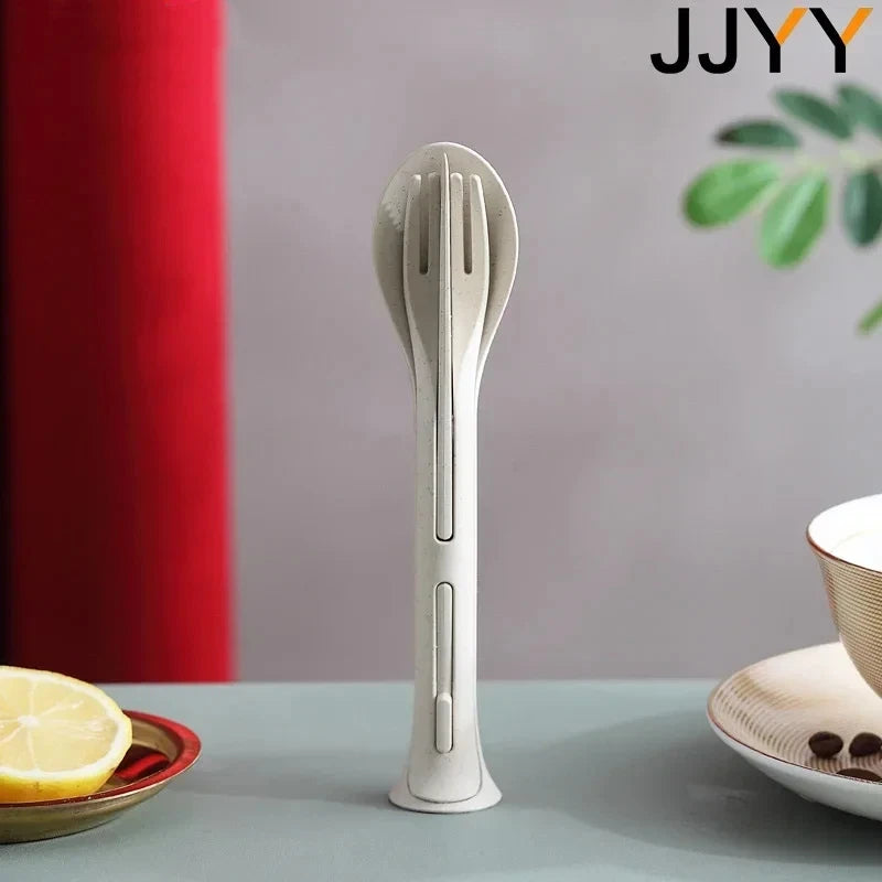 Multi-functional kawaii utensils with JJYY branding on a table with a lemon and bowl.