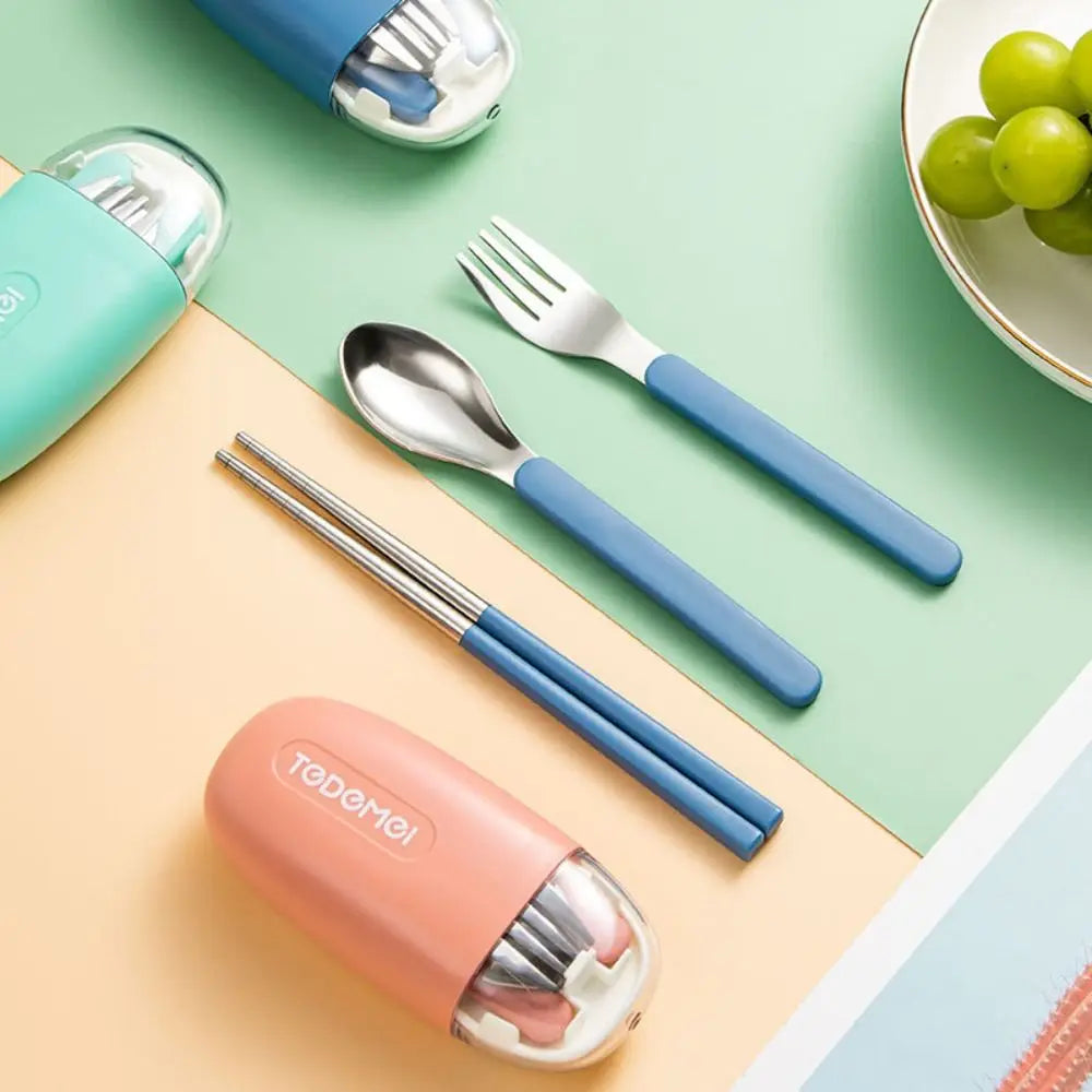 Set of blue and pink kawaii utensils set with a container on a colorful background