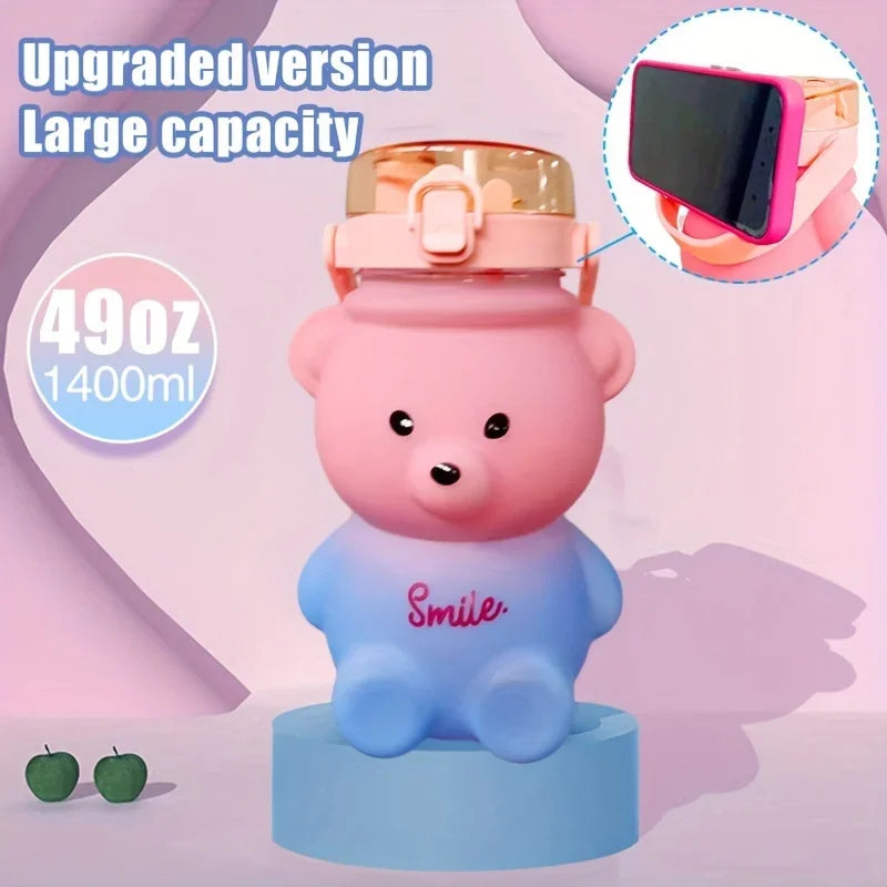 Pink bear-shaped kawaii water bottle with a phone holder on a pink background