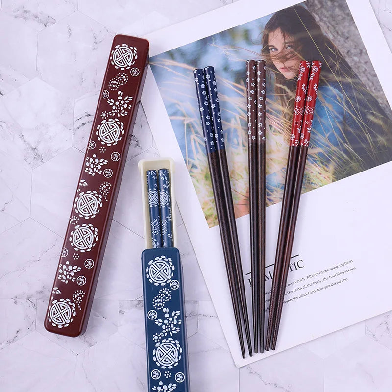 Set of decorative kawaii chopsticks with a holder on a magazine background