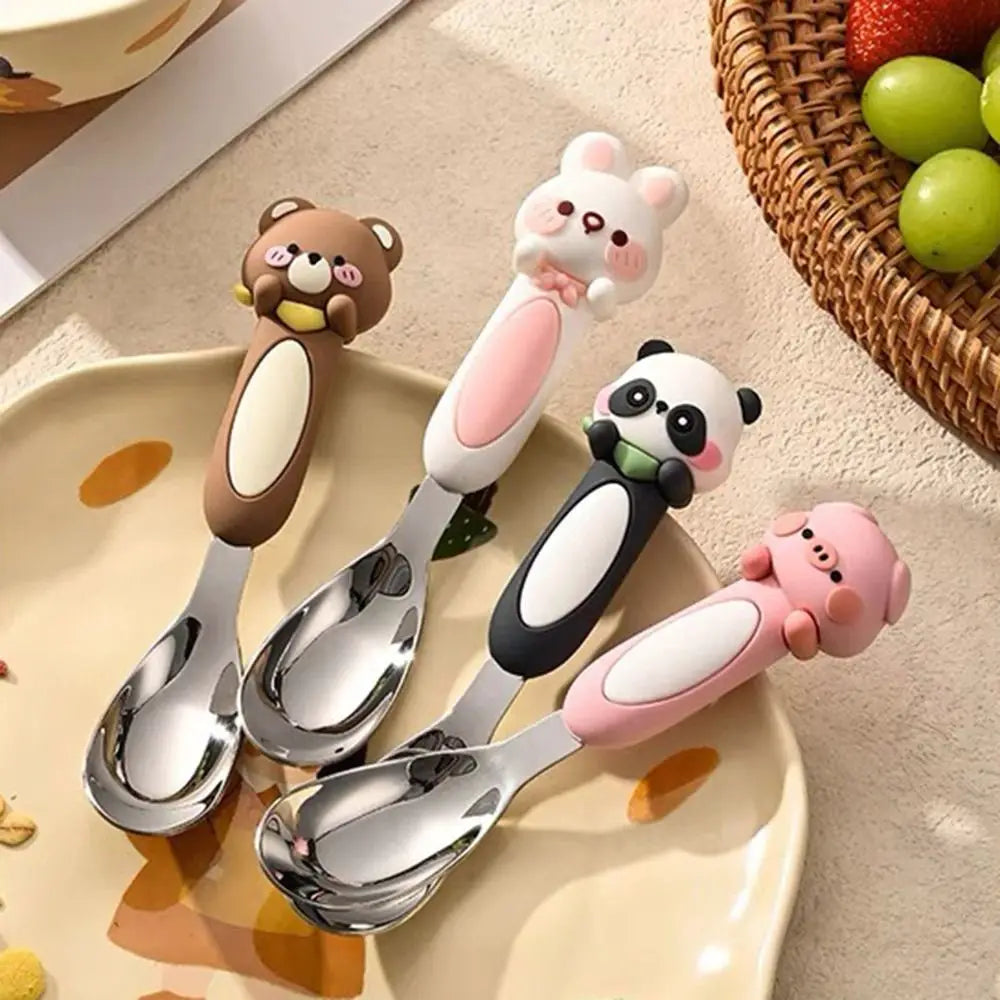 A group of animal designed kawaii spoons on a dinner plate