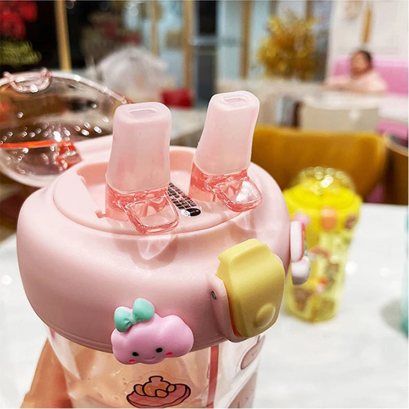 Pink cartoon-style kawaii cup with a small character on a blurred background