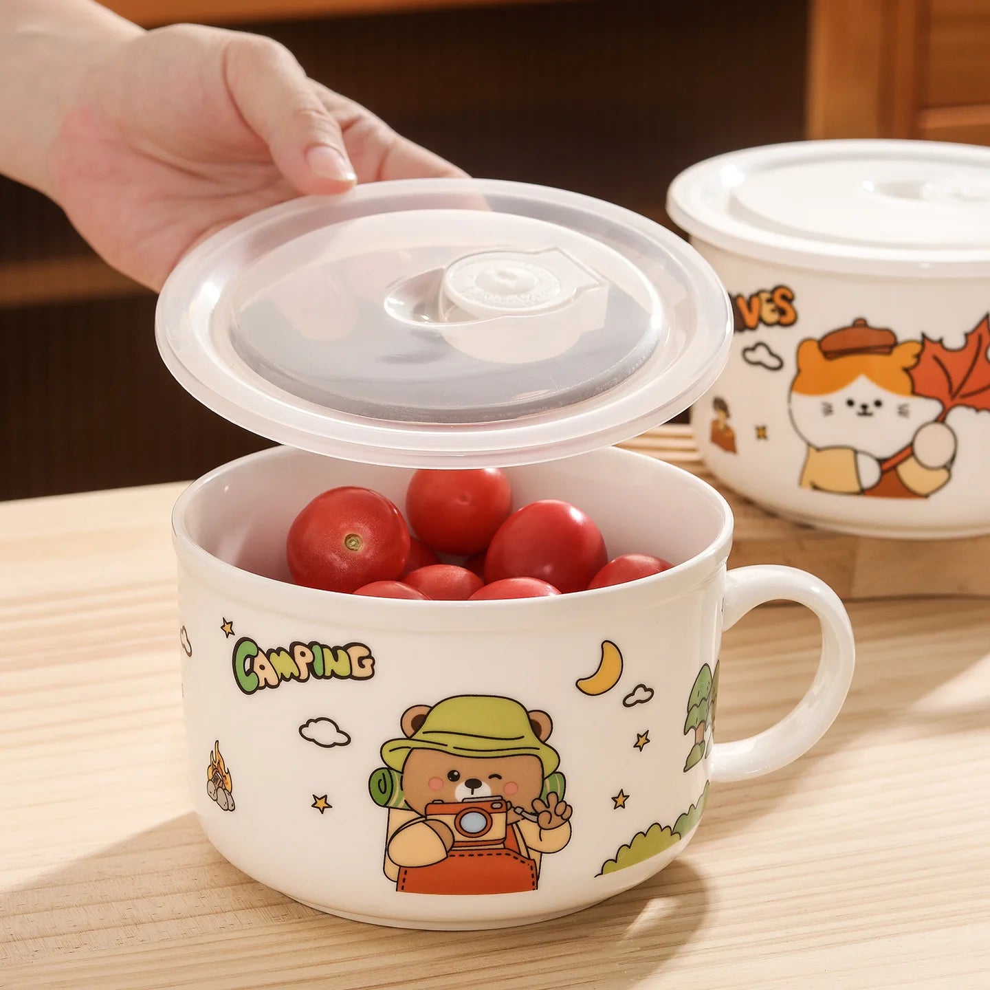 Someone opening the lid of a cartoon themed kawaii ramen bowl