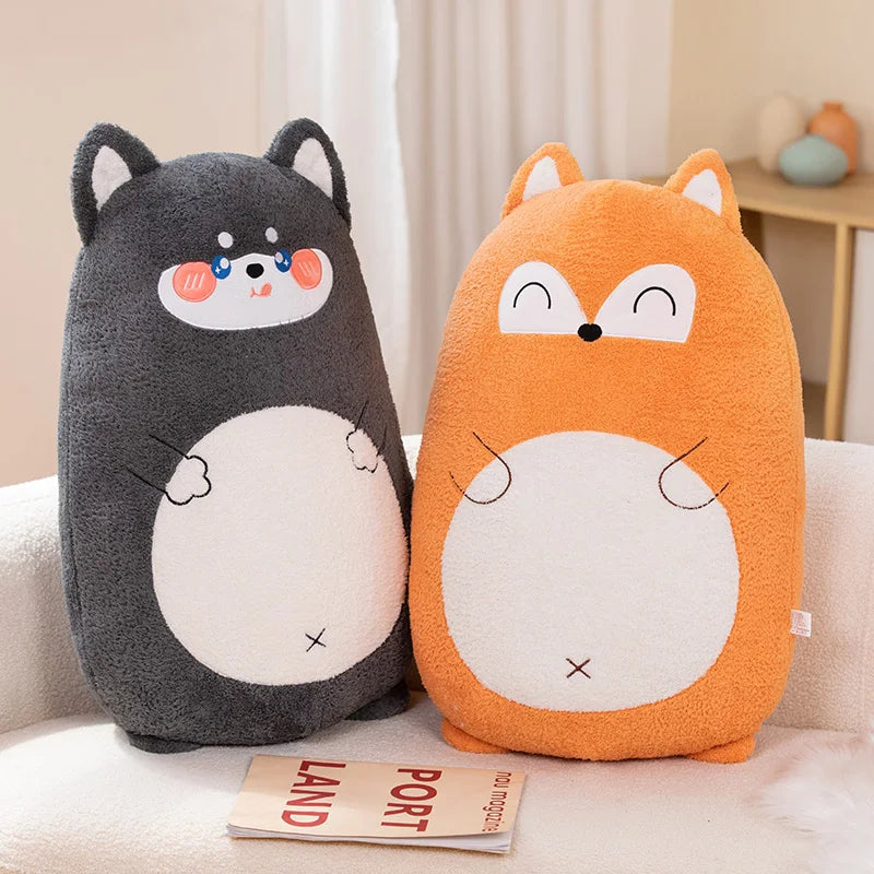 Two cartoon-style kawaii cushions shaped like a bear and a fox on a couch.
