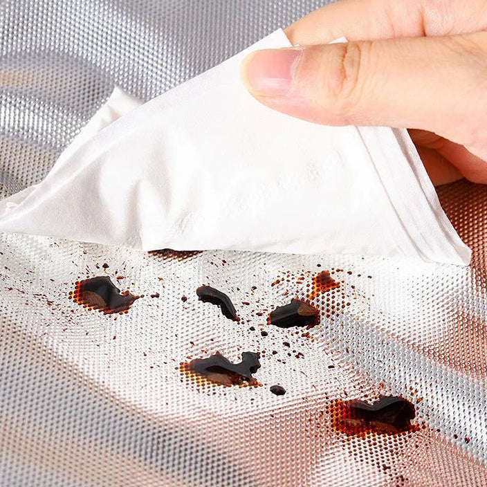 Kawaii bag with aluminum foil lining being used to clean up food stains.
