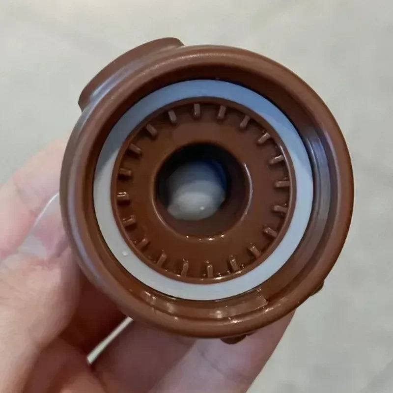 Brown kawaii water bottle held in a hand against a neutral background